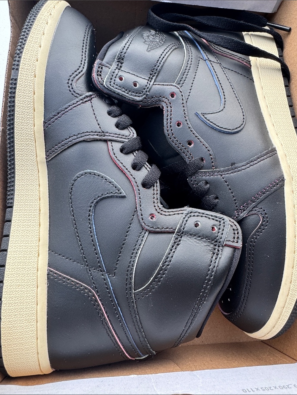 Nike Black High-Top Sneakers with Cream Sole and Subtle Red/Blue Stitching
